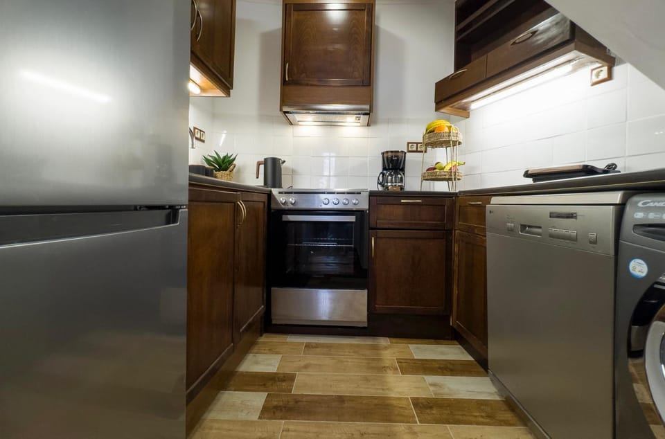 Kitchen or kitchenette, dishwasher, oven, stove, toaster, washing machine, dryer