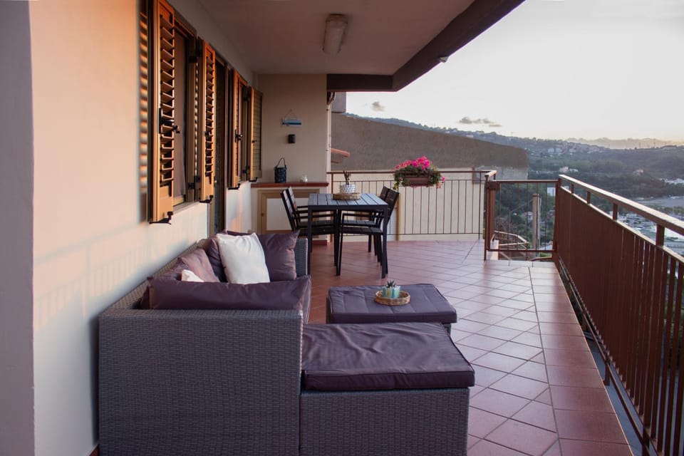 Property building, Patio, Natural landscape, View (from property/room), Balcony/Terrace, Living room, Seating area, Dining area