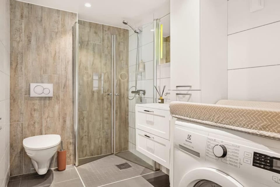 Shower, Toilet, Bathroom, towels, washing machine, dryer