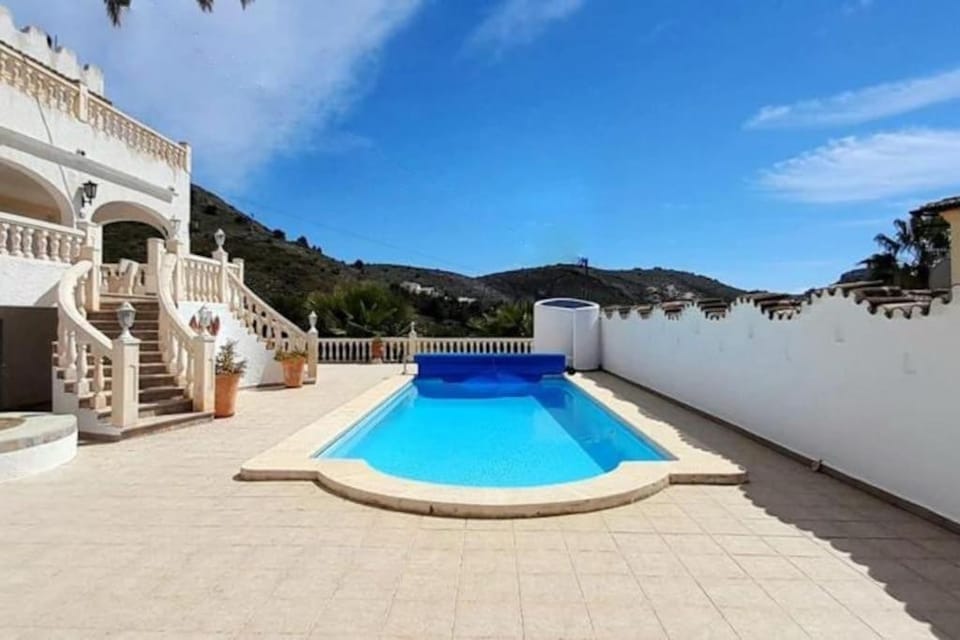 Property building, Patio, View (from property/room), Balcony/Terrace, Mountain view, Pool view, Swimming pool, sunbed
