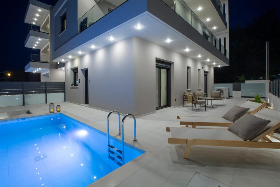Property building, Patio, Night, Natural landscape, Pool view, Swimming pool, sunbed
