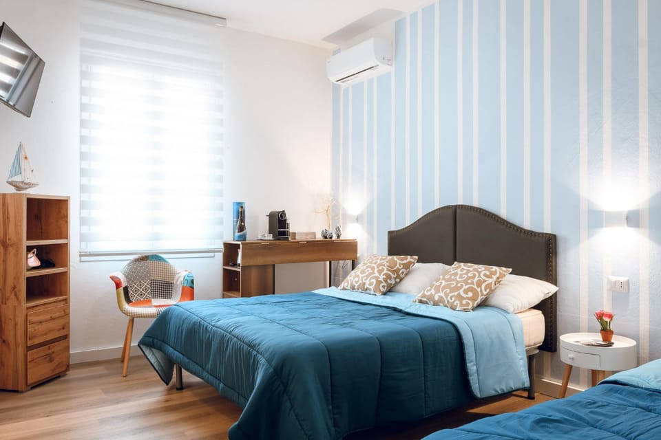 Bed, People, View (from property/room), Photo of the whole room, Decorative detail, Decorative detail, Beach, Bedroom, Guests, City view, City view, Garden view, young children, older children, Family, fireplace, furniture, heating, internet, locker, microwave, towels, trouser press, wedding, air conditioner