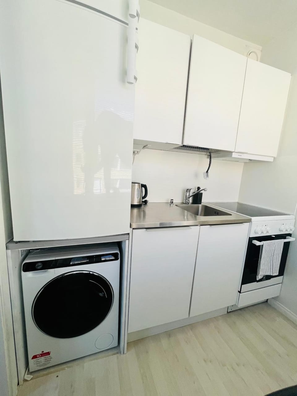 Kitchen or kitchenette, dishwasher, oven, stove