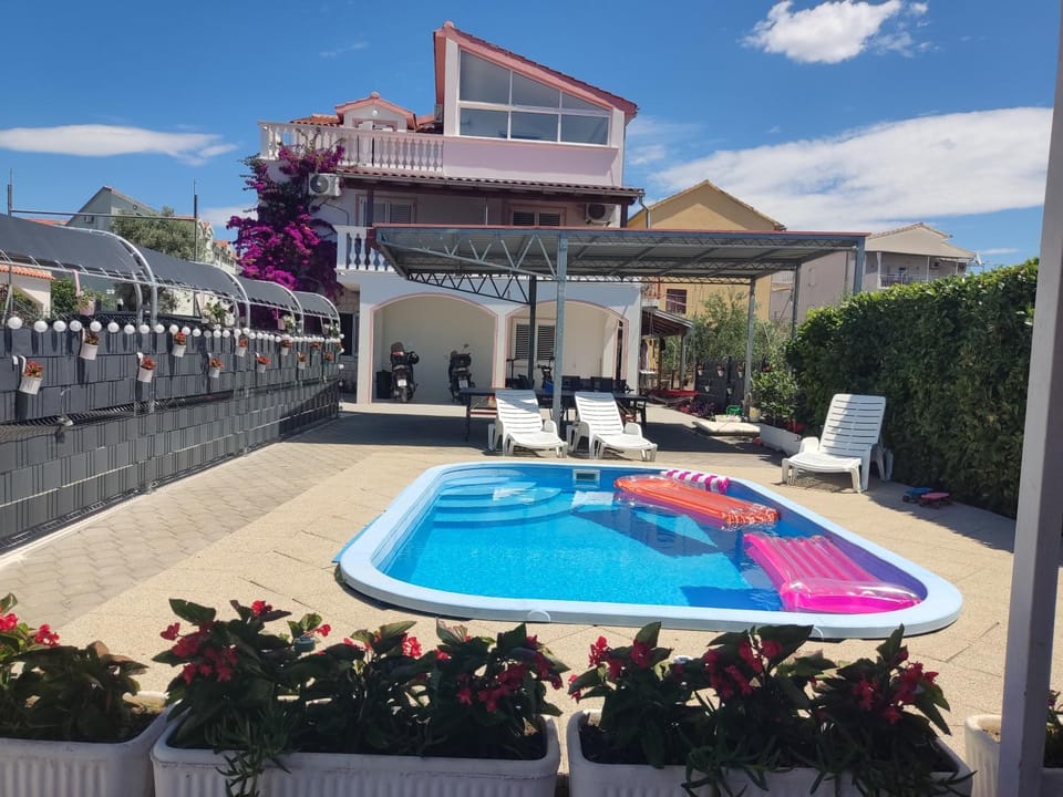 Property building, Seating area, Swimming pool