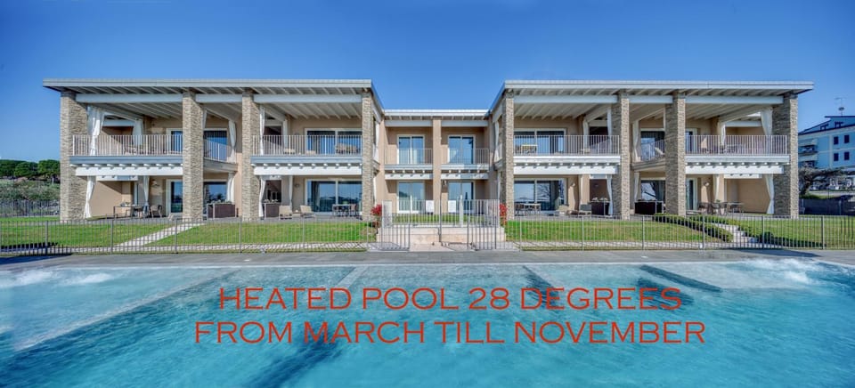 Property building, Day, Text overlay, Pool view, Swimming pool