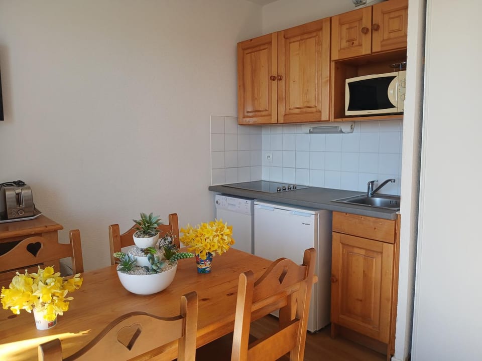 Living room, microwave, stove, toaster, kitchen