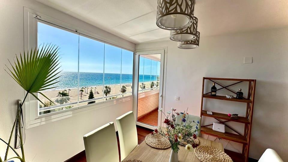 View (from property/room), Living room, Seating area, Dining area, Sea view