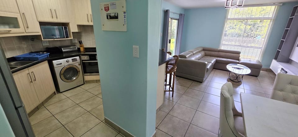Living room, Seating area, washing machine, kitchen