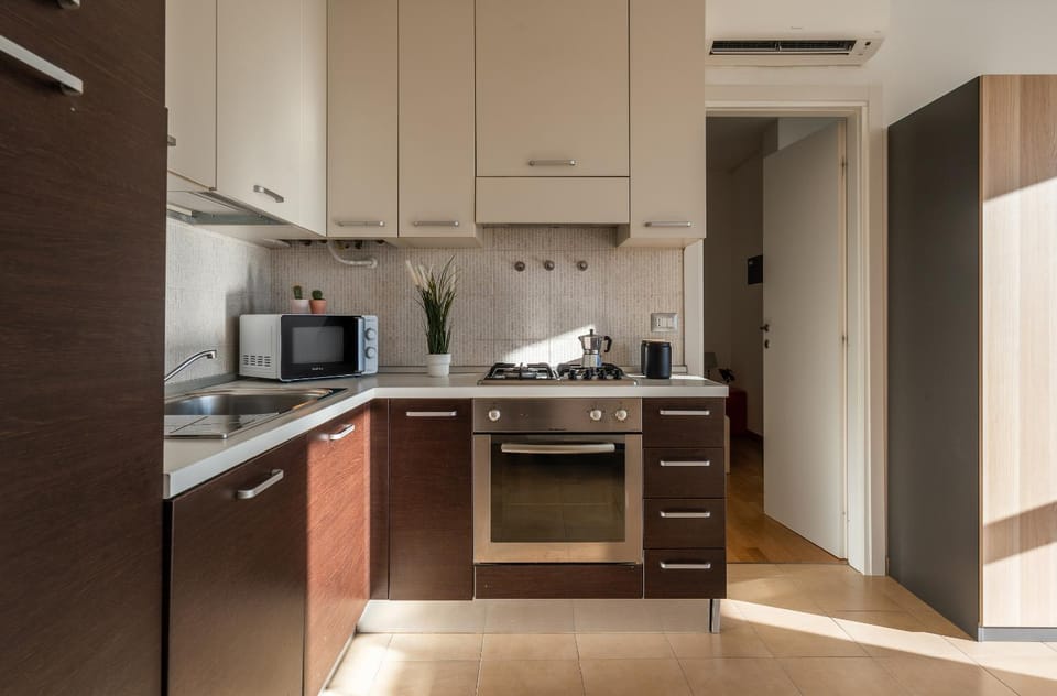 Kitchen or kitchenette, dishwasher, oven, stove