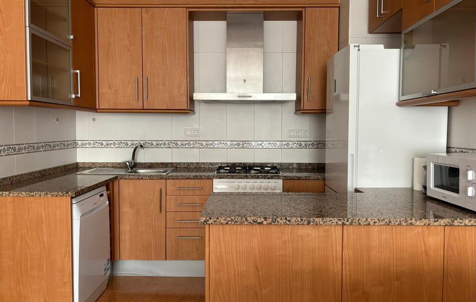 Kitchen or kitchenette, dishwasher, microwave, oven, storage, kitchen