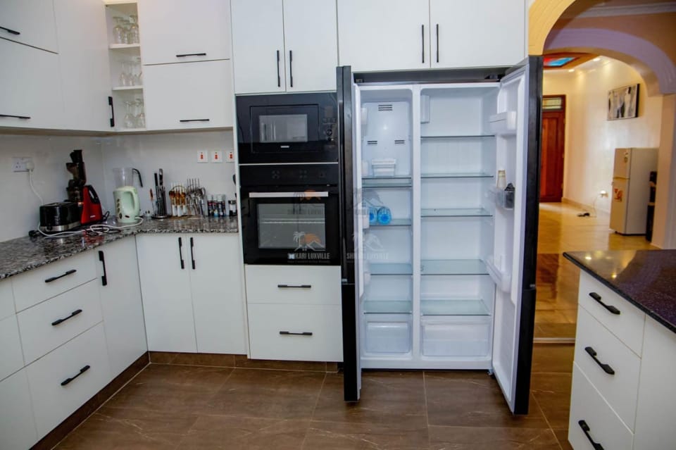 Kitchen or kitchenette, dishwasher, oven, stove