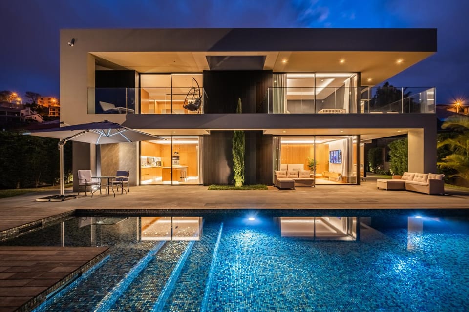 Property building, Patio, Night, Pool view, Swimming pool, Swimming pool, sunbed