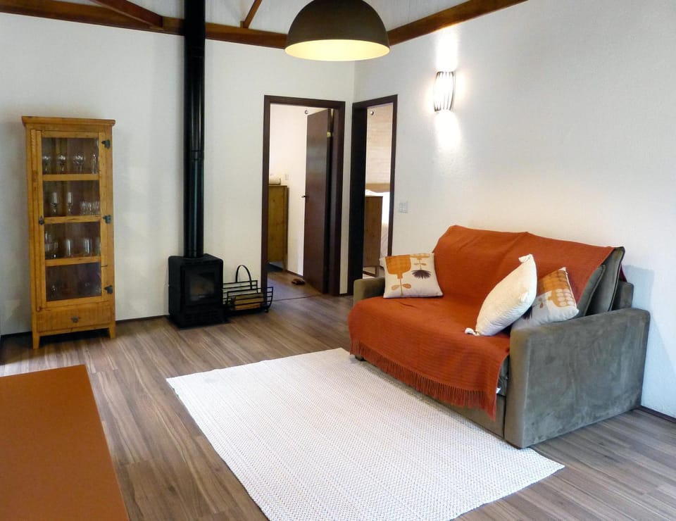 Bed, TV and multimedia, Living room, Seating area, Bedroom