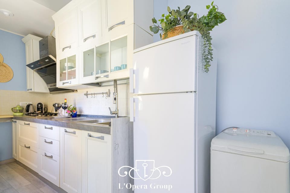 Kitchen or kitchenette, stove, washing machine