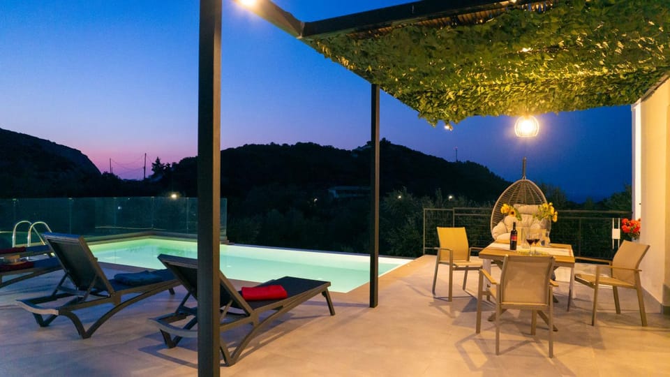 Patio, Night, Natural landscape, Dining area, Pool view, Swimming pool, sunbed