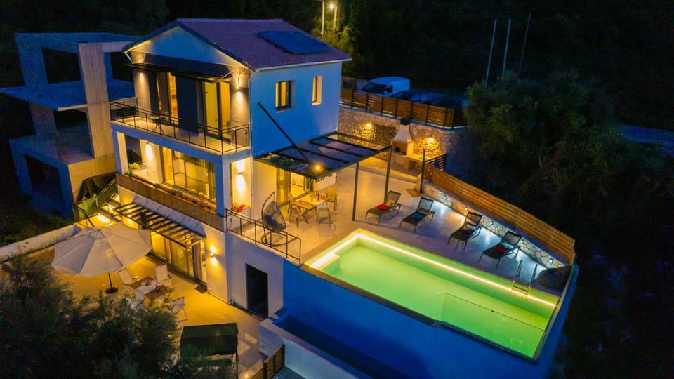 Property building, Patio, Night, Pool view, Swimming pool, sunbed