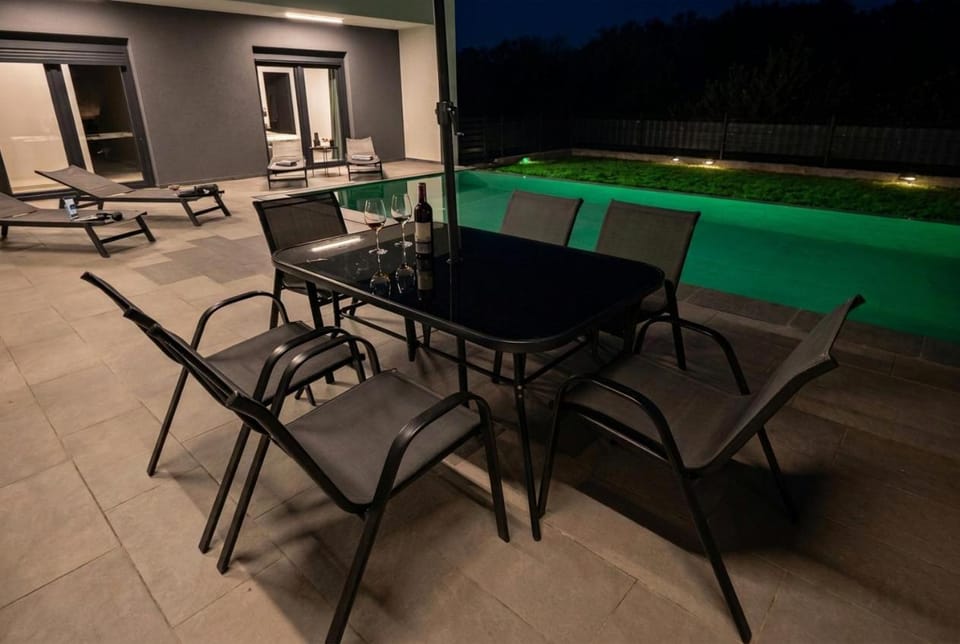 Night, Balcony/Terrace, Seating area, Pool view