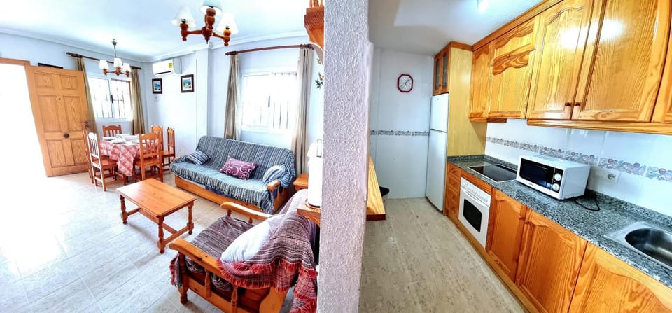 Kitchen or kitchenette, Living room, Seating area, Dining area, dishwasher, oven, stove, toaster