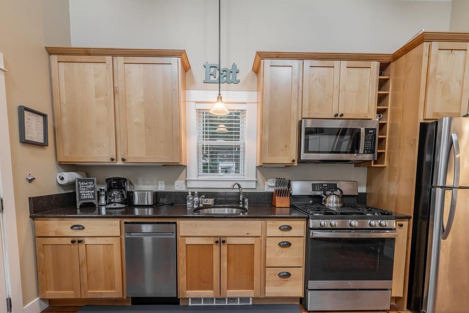 Kitchen or kitchenette, dishwasher, oven, stove, toaster