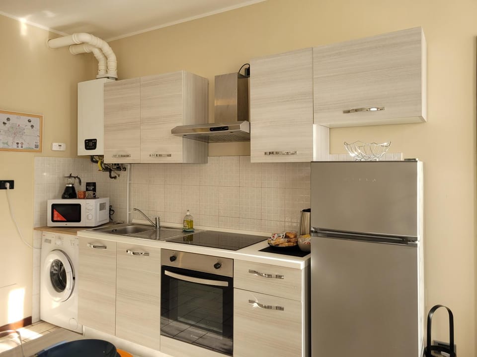 Kitchen or kitchenette, oven, stove, washing machine