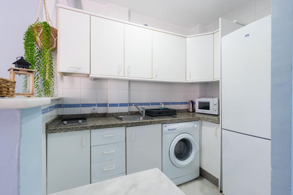 Kitchen or kitchenette, washing machine