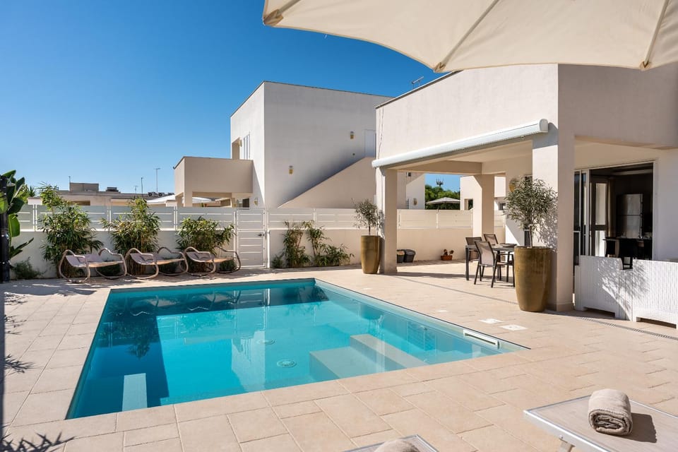 Property building, Patio, Pool view, Swimming pool, Inner courtyard view, sunbed