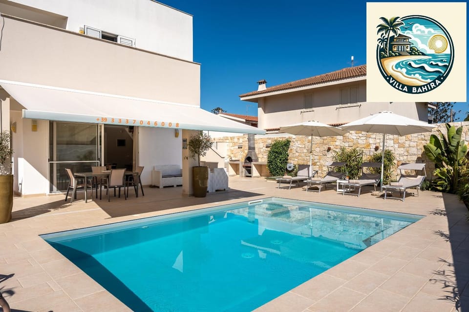 Property building, Patio, Pool view, Swimming pool, sunbed