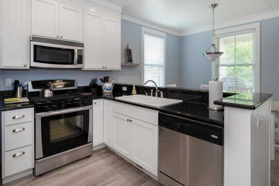 Kitchen or kitchenette, dishwasher, oven, stove