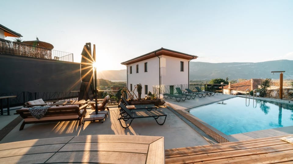 Patio, Seating area, Sea view, Swimming pool, Sunset, sunbed