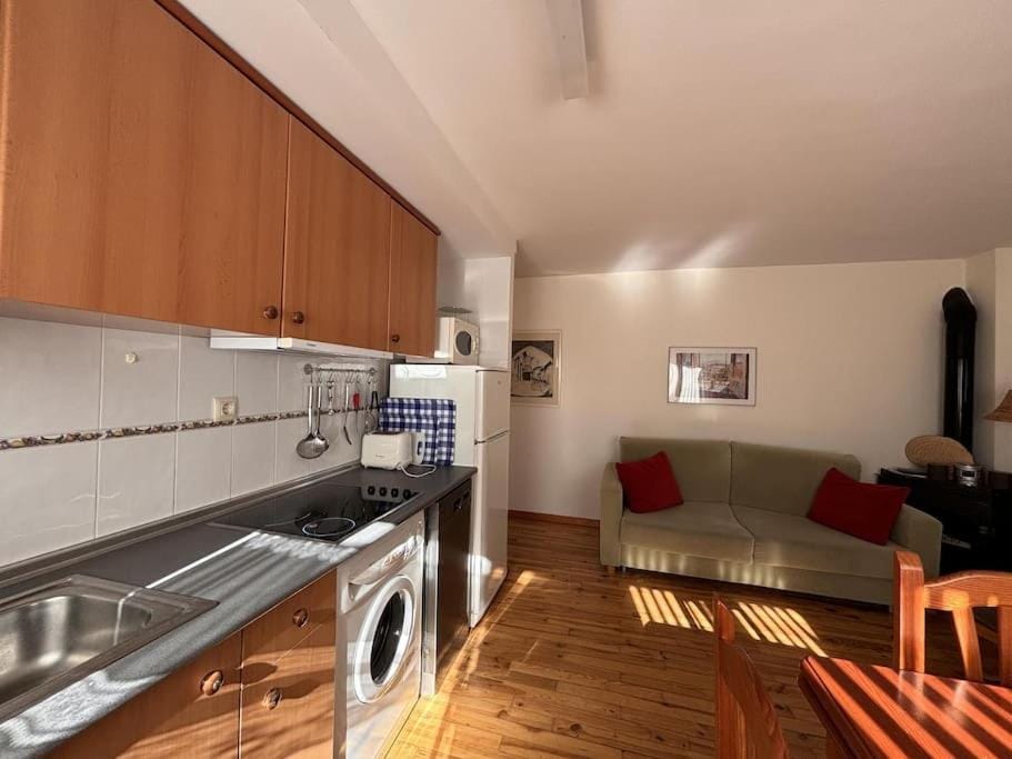 Kitchen or kitchenette, stove, washing machine