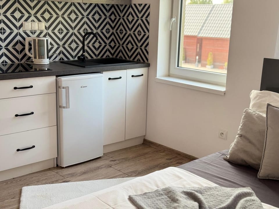 Photo of the whole room, stove, wardrobe