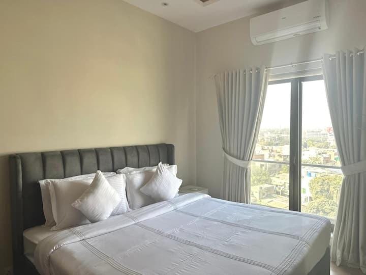 The Opus Luxury Residences by NAMUVE W GYM AND ROOFTOP Apartment in Lahore