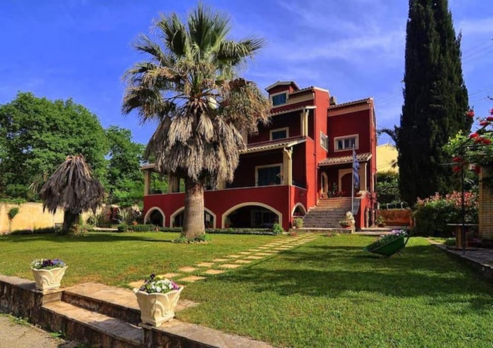 Little Red in Green House in Corfu, Greece