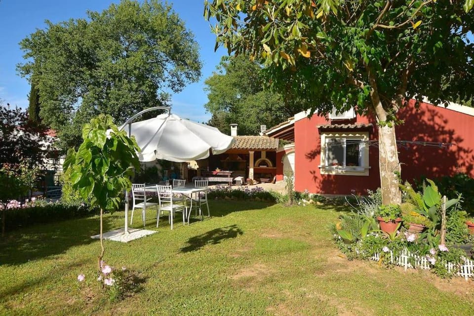 Little Red in Green House in Corfu, Greece