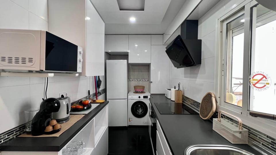 Kitchen or kitchenette, oven, stove, toaster, washing machine