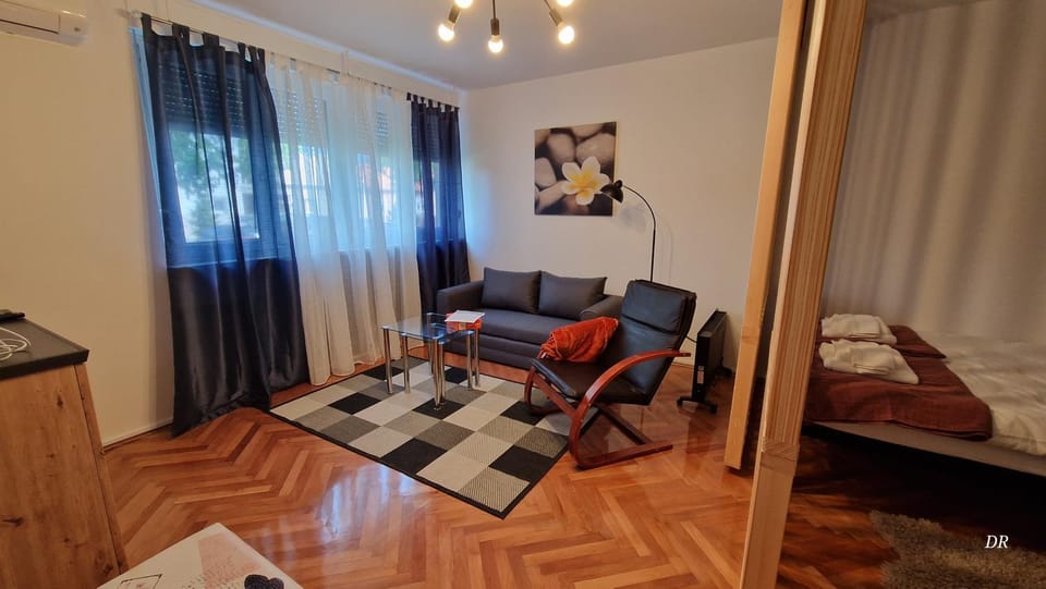 Bed, TV and multimedia, Living room, Seating area, air conditioner