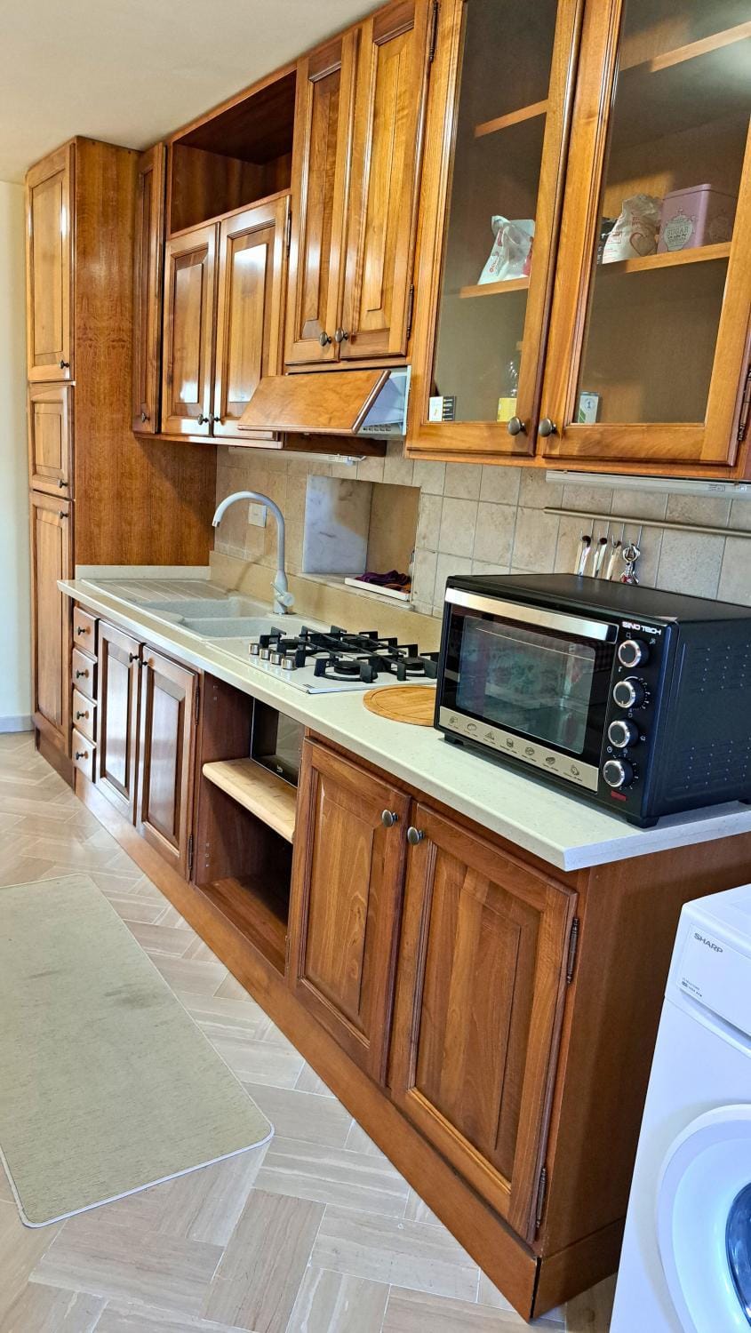 Kitchen or kitchenette, dishwasher, oven, stove
