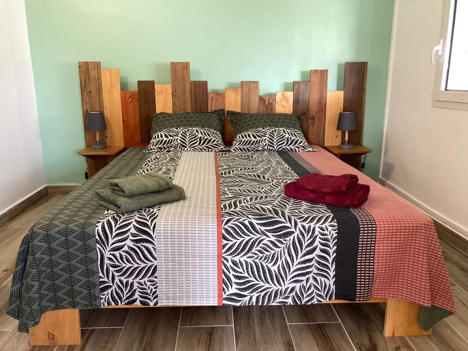 Bed, cot, flat iron, towels