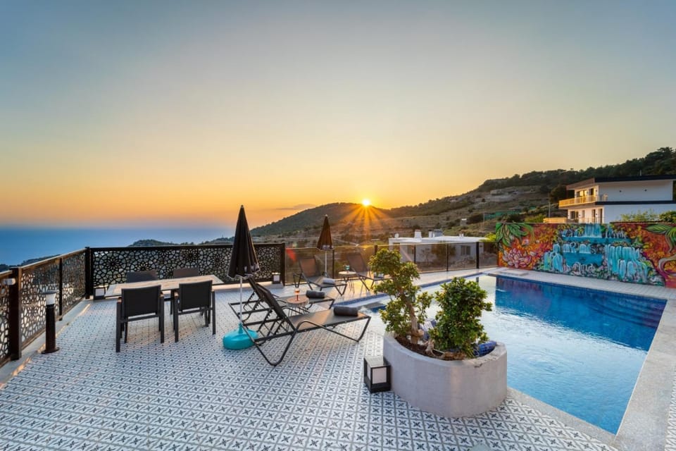 Patio, Balcony/Terrace, Dining area, Mountain view, Sea view, Swimming pool, Sunset, sunbed