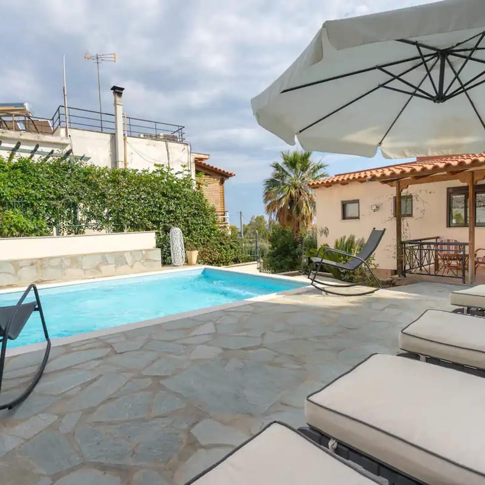 Property building, Patio, Pool view, Swimming pool, sunbed