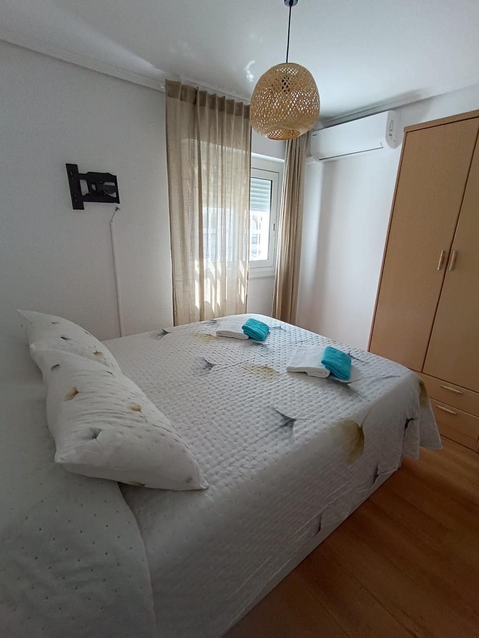 Photo of the whole room, towels, wardrobe, air conditioner