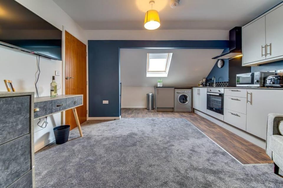 Kitchen or kitchenette, dishwasher, oven, stove, toaster, washing machine