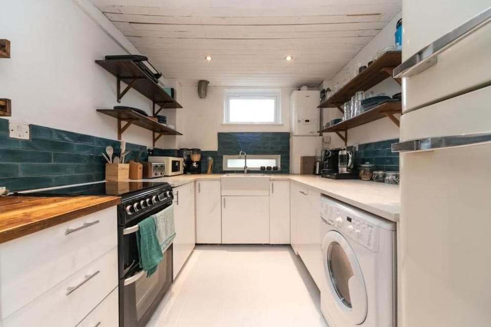 Kitchen or kitchenette, dishwasher, oven, stove, washing machine, dryer