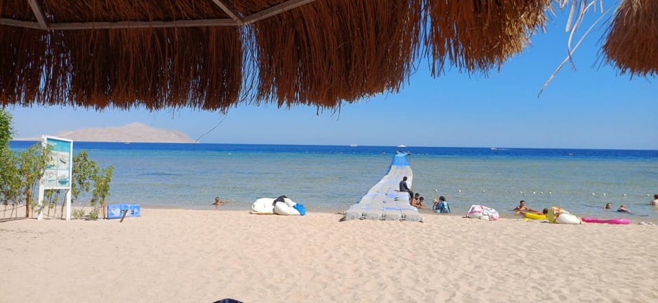 Nearby landmark, Day, People, Natural landscape, Beach, Sea view, group of guests, sunbed
