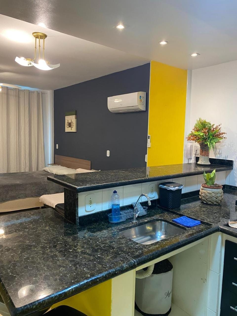 Kitchen or kitchenette, stove, air conditioner