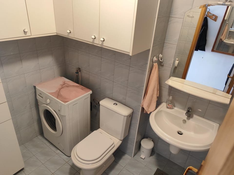 Shower, Toilet, Bathroom, towels, washing machine, dryer