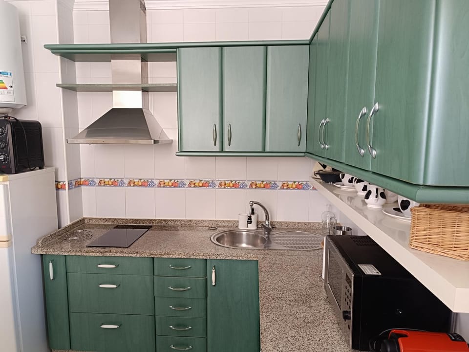 Kitchen or kitchenette, microwave, stove