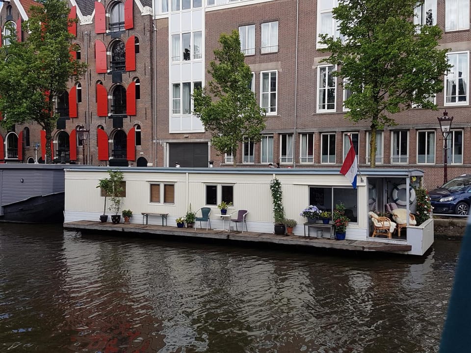 Pantheos Top Houseboat Docked boat in Amsterdam