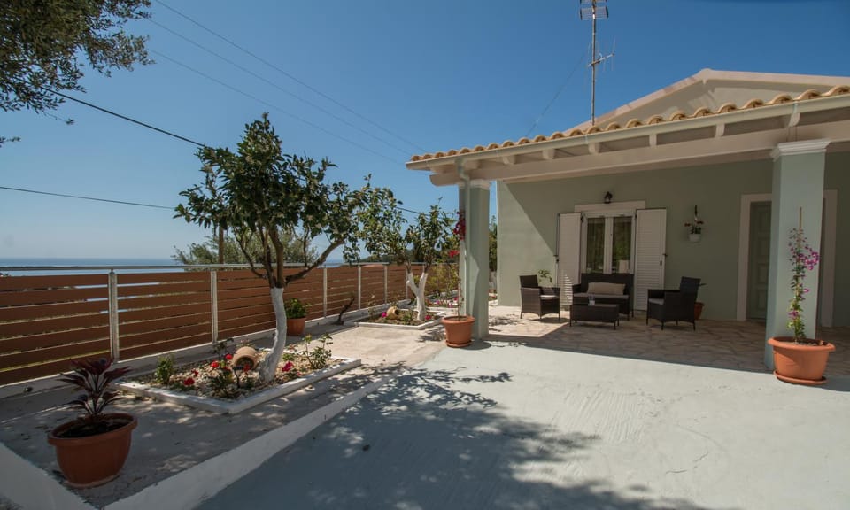 Property building, Patio, Day, Natural landscape, Garden, View (from property/room), Balcony/Terrace, Garden view, Sea view