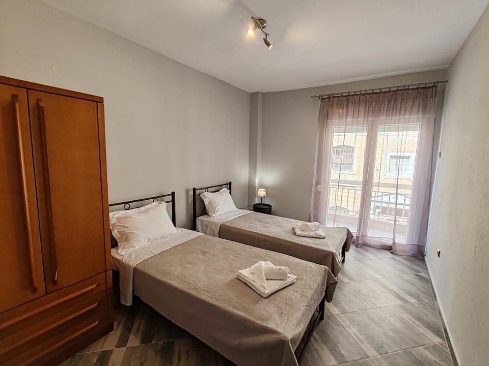 Bed, towels, wardrobe